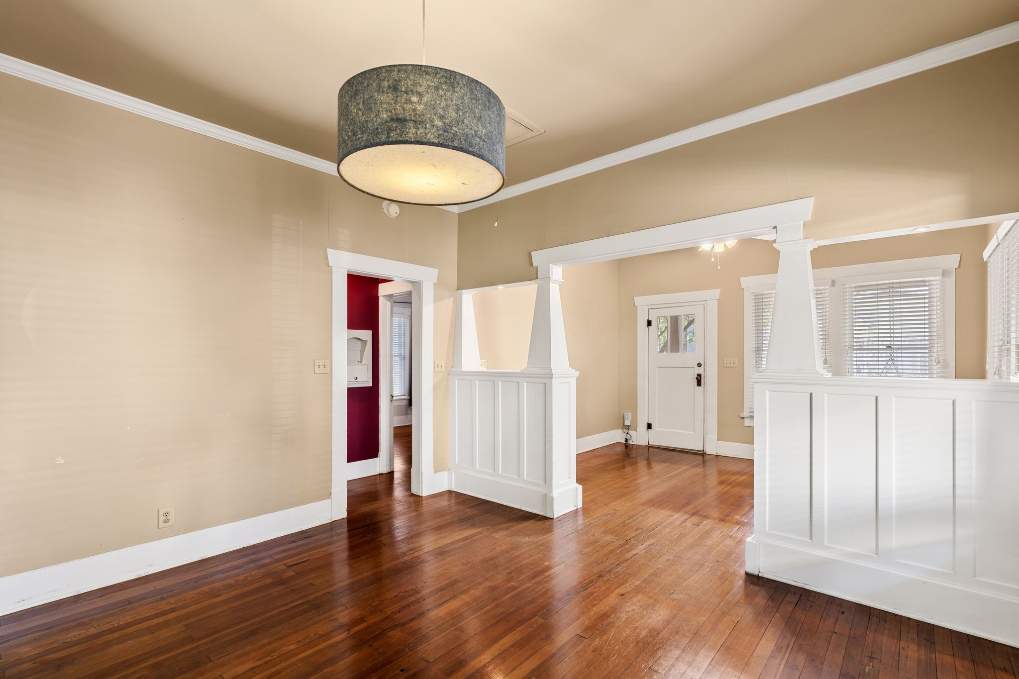 217 Teetshorn Street Houston, TX 77009 - Photo 14 of 21 a view of an empty room with wooden floor and a window