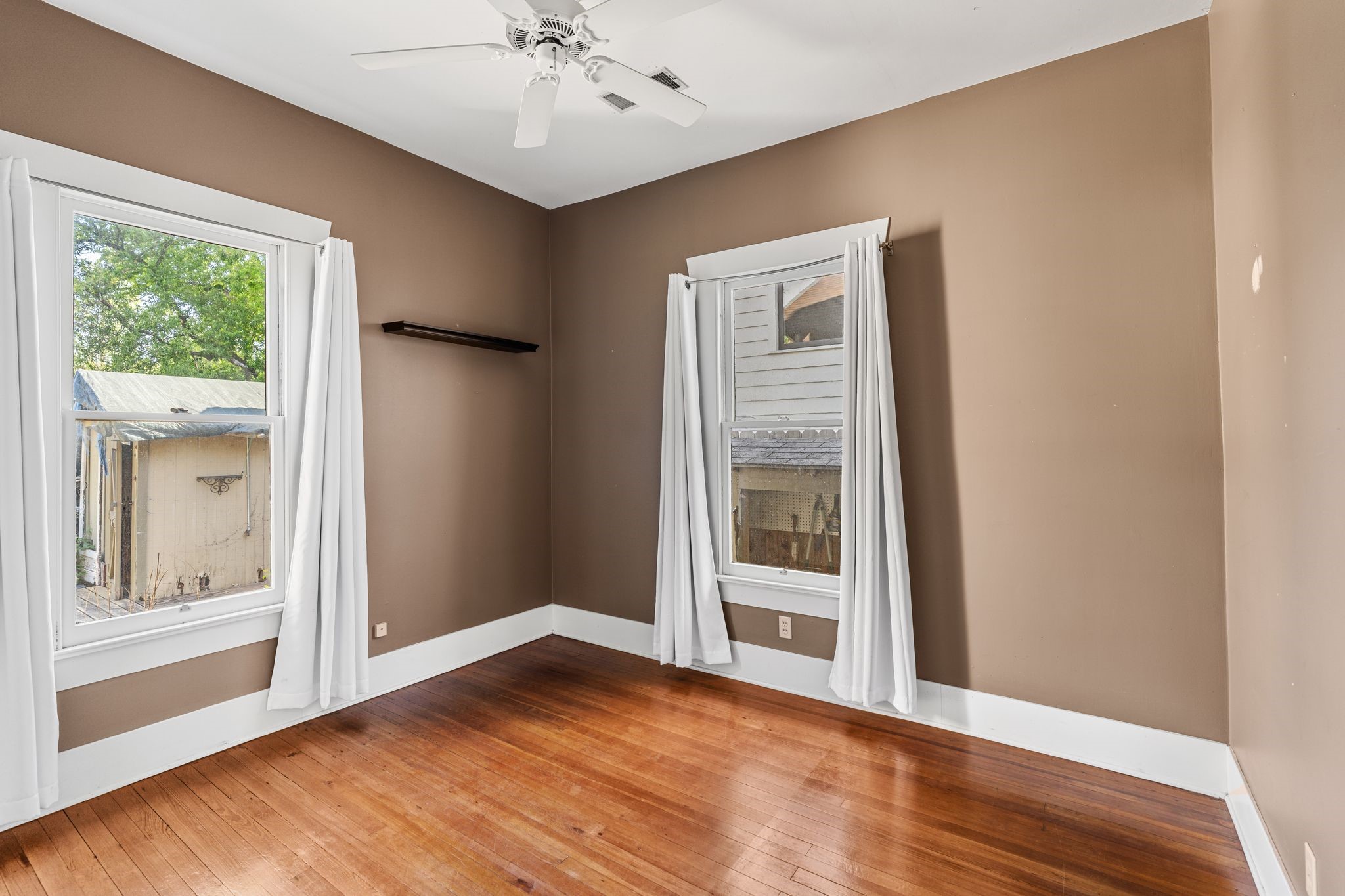 217 Teetshorn Street Houston, TX 77009 - Photo 18 of 21 a view of an empty room with a window