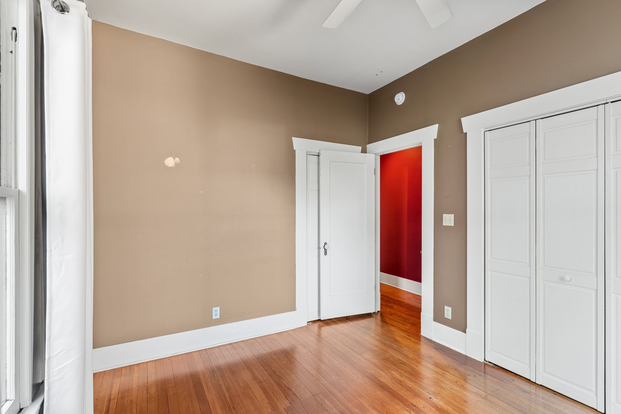 217 Teetshorn Street Houston, TX 77009 - Photo 19 of 21 a view of an empty room with wooden floor