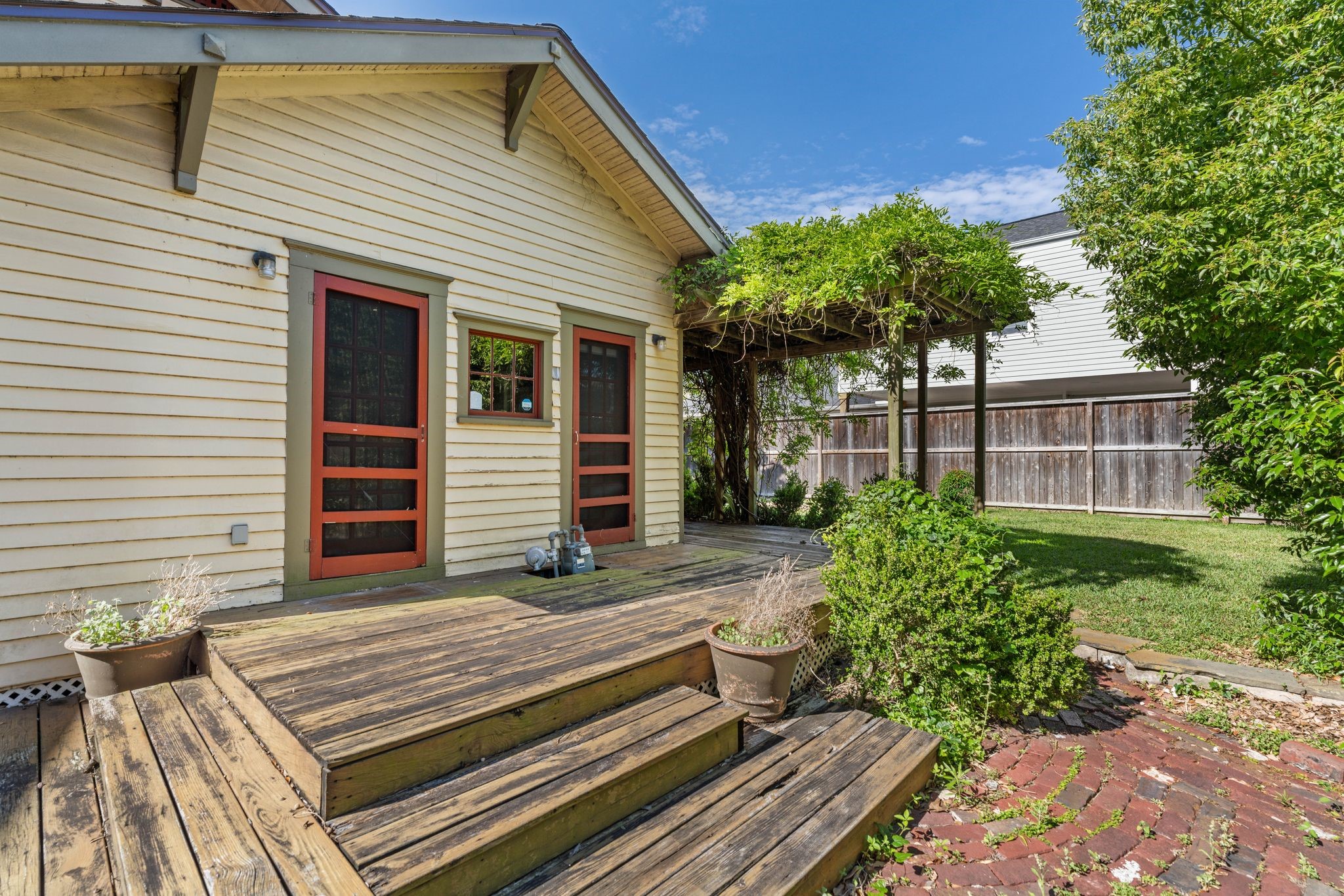 217 Teetshorn Street Houston, TX 77009 - Photo 20 of 21 a front view of a house with a garden