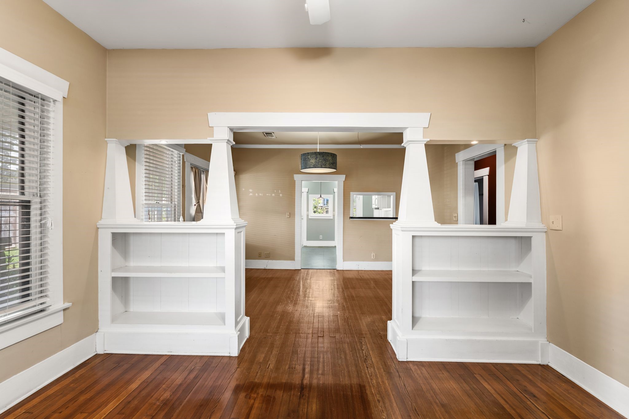 217 Teetshorn Street Houston, TX 77009 - Photo 7 of 21 a view of a hallway with wooden floor and cabinet