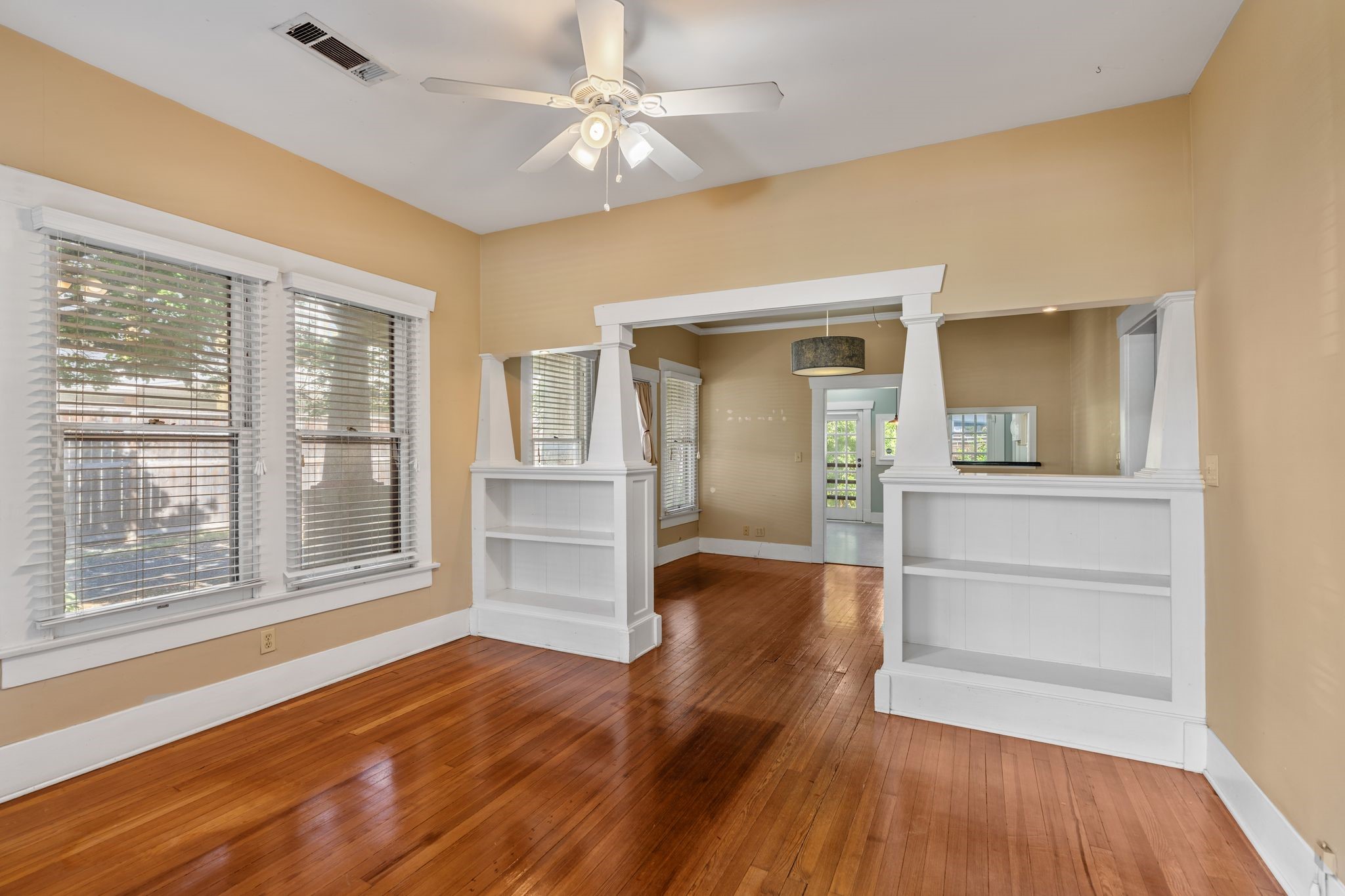 217 Teetshorn Street Houston, TX 77009 - Photo 8 of 21 a view of empty room with wooden floor and fan