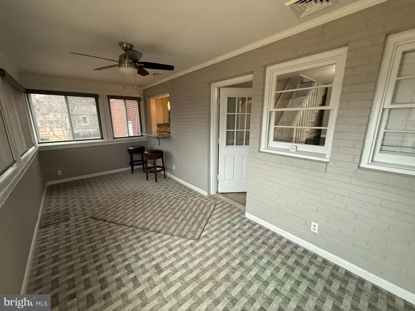 a view of empty room with windows