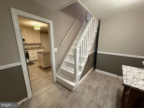 a view of a hallway view with staircase