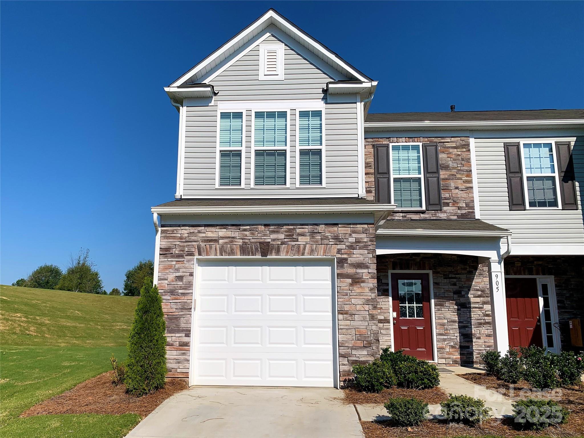 905 Wicawa Road Fort Mill, SC 29708 - Photo 2 of 29 a front view of a house with garden