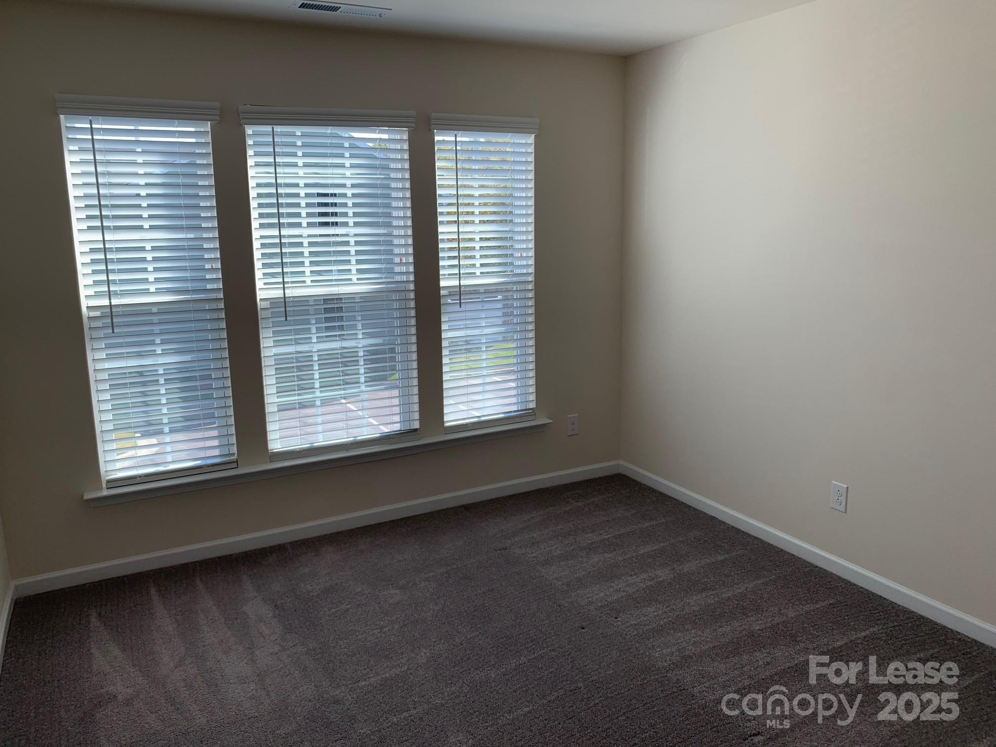 905 Wicawa Road Fort Mill, SC 29708 - Photo 24 of 29 a view of an empty room with a window