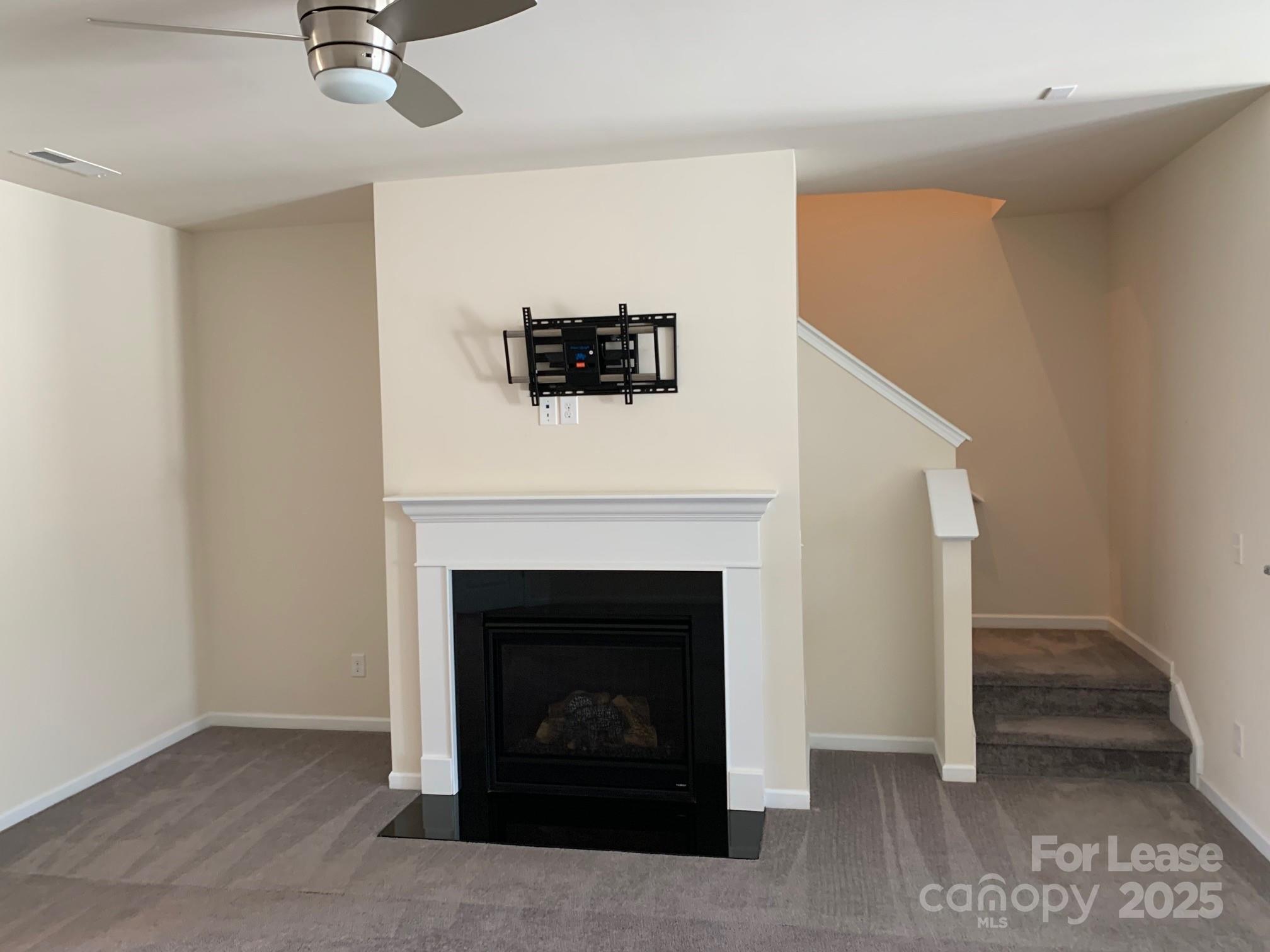 905 Wicawa Road Fort Mill, SC 29708 - Photo 9 of 29 a living room with furniture and a fireplace