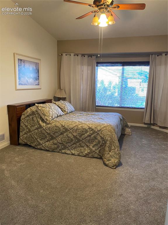9362 St.George Road Peyton, CO 80831 - Photo 16 of 32 a bed sitting in a spacious bedroom next to a window