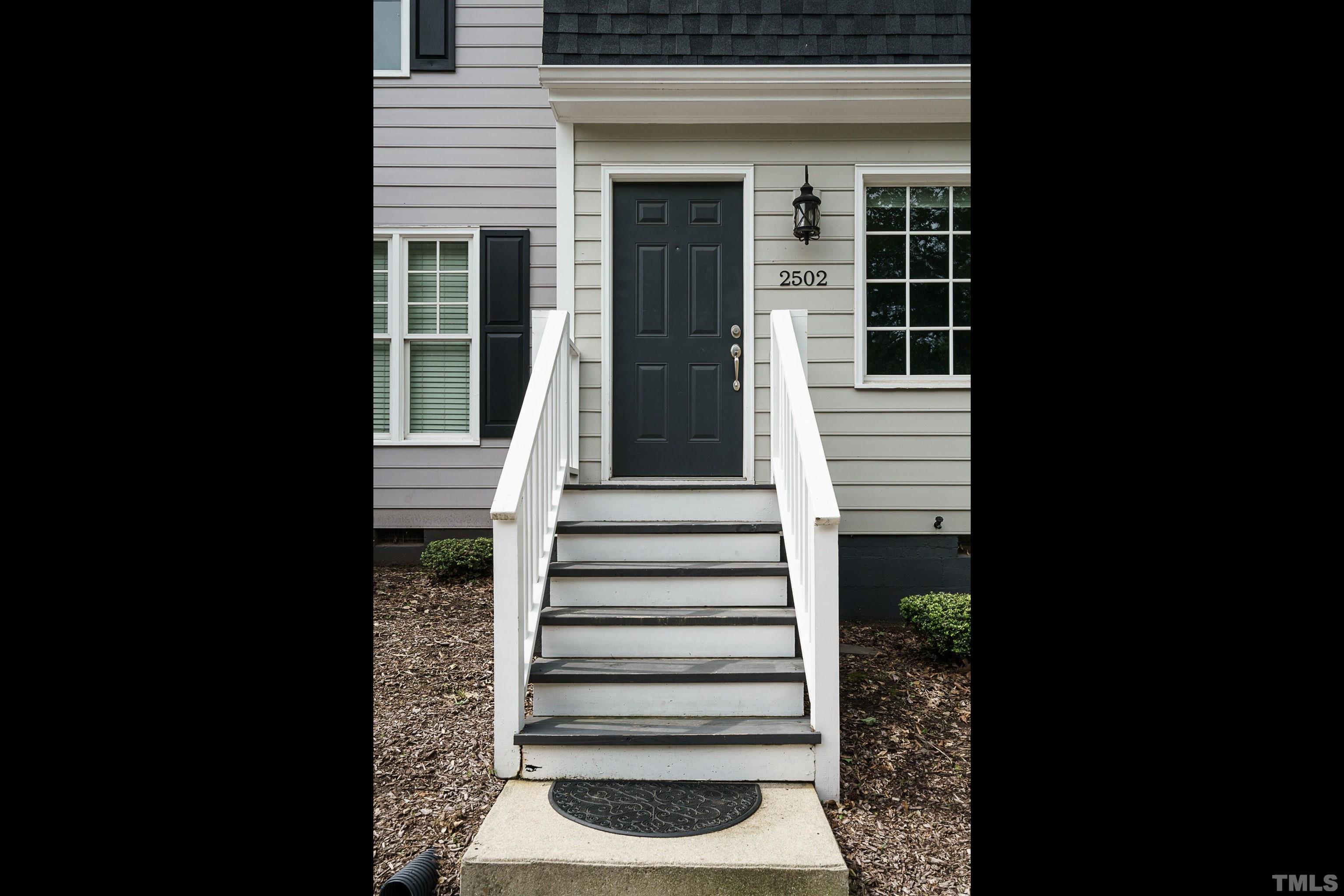 2502 Noble Road Raleigh, NC 27608 - Photo 2 of 19 a view of a house with a window and stairs