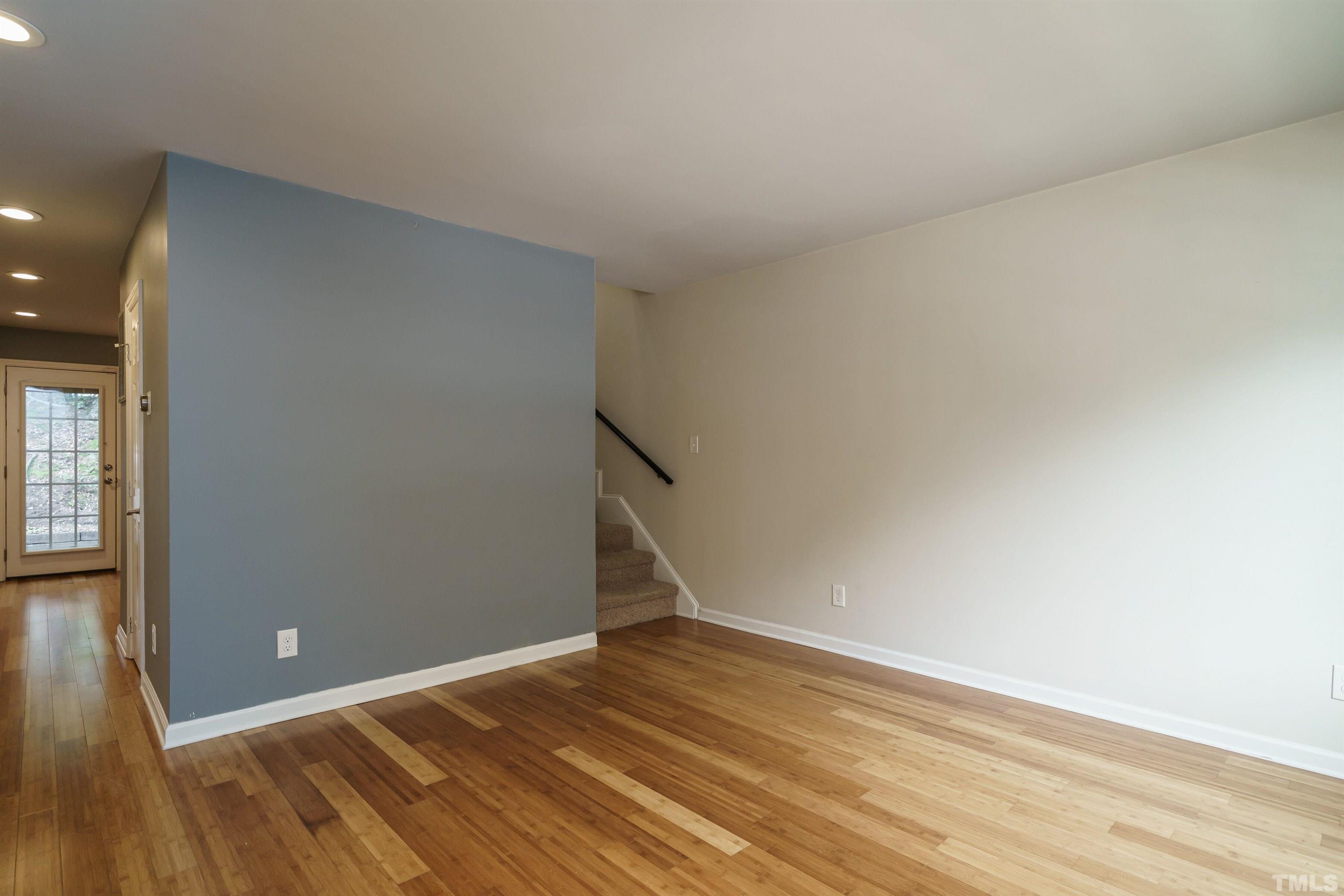 2502 Noble Road Raleigh, NC 27608 - Photo 5 of 19 a view of empty room with wooden floor