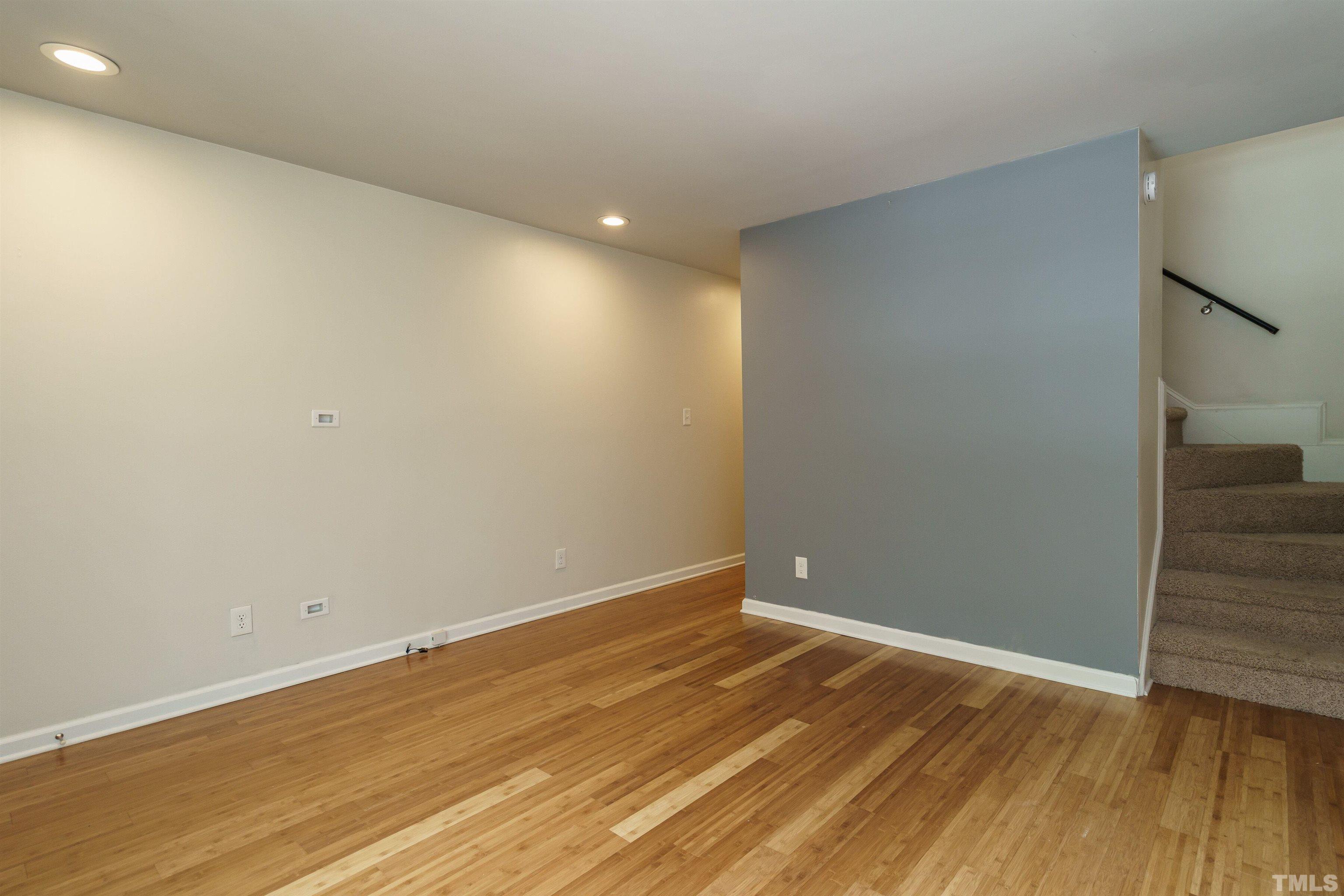 2502 Noble Road Raleigh, NC 27608 - Photo 6 of 19 a view of room with wooden floor