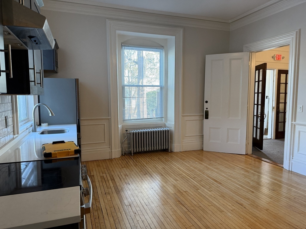 73 Elm Road, Unit 4 Newton, MA 02460 - Photo 5 of 12 a view of livingroom with furniture and wooden floor