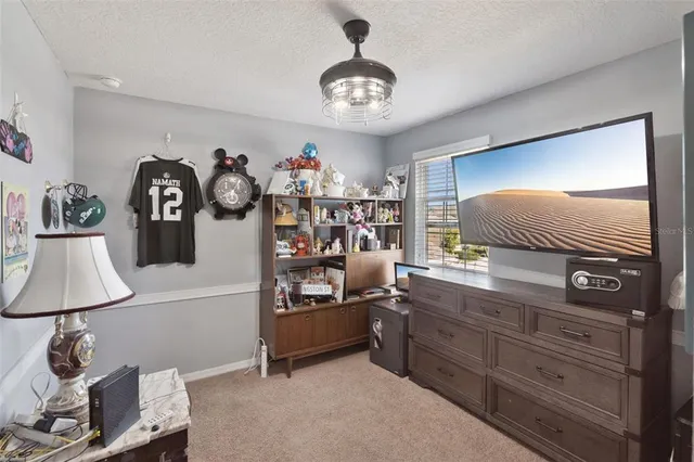 a bathroom with a granite countertop bathtub shower sink and vanity