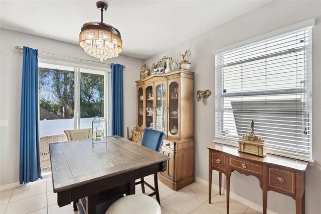 a view of a dining room with furniture wooden floor and chandelier