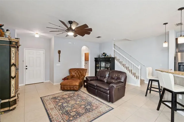 a living room with furniture and a rug