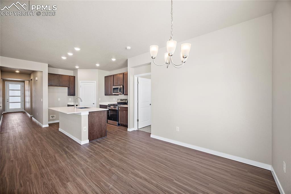 9653 Pinpoint Drive Fountain, CO 80817 - Photo 16 of 34 a view of kitchen with granite countertop cabinets a counter top space and stainless steel appliances