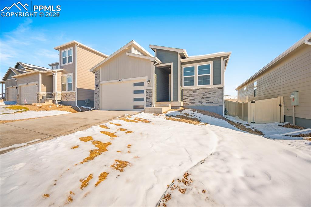9653 Pinpoint Drive Fountain, CO 80817 - Photo 2 of 34 a front view of a house with a yard