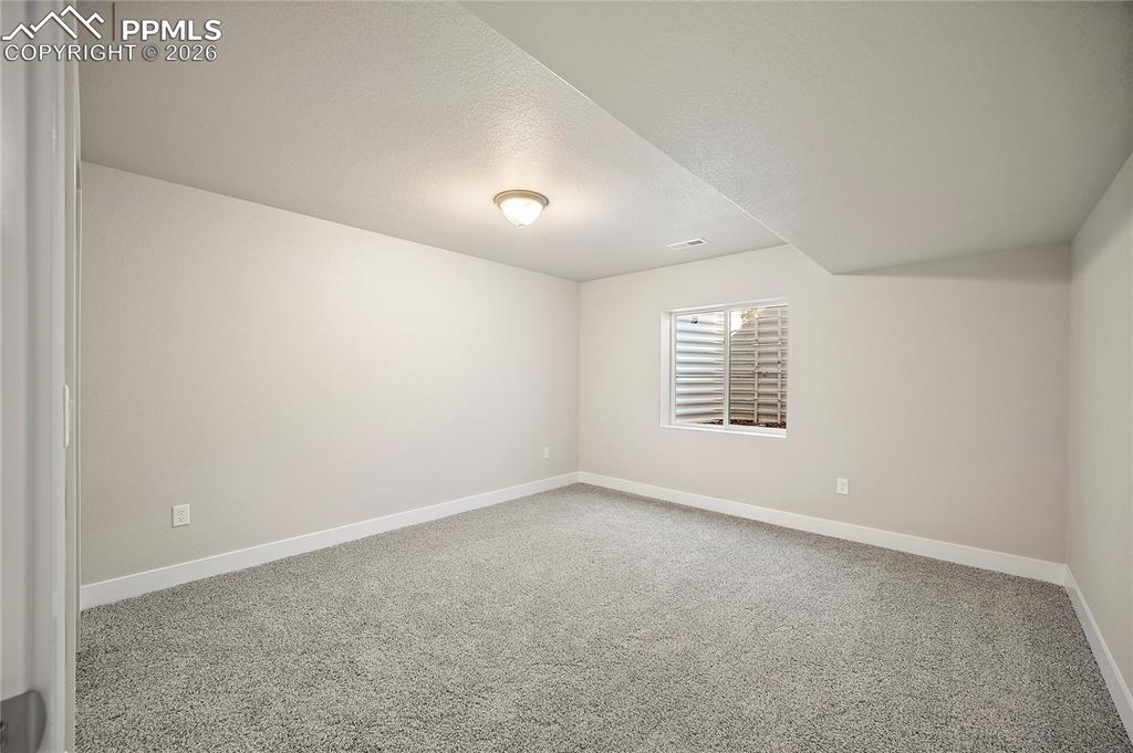 9653 Pinpoint Drive Fountain, CO 80817 - Photo 29 of 34 a view of an empty room with a window