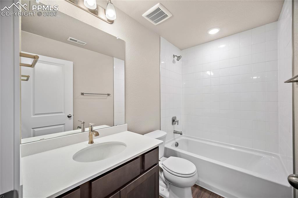 9653 Pinpoint Drive Fountain, CO 80817 - Photo 30 of 34 a bathroom with a sink a toilet and shower