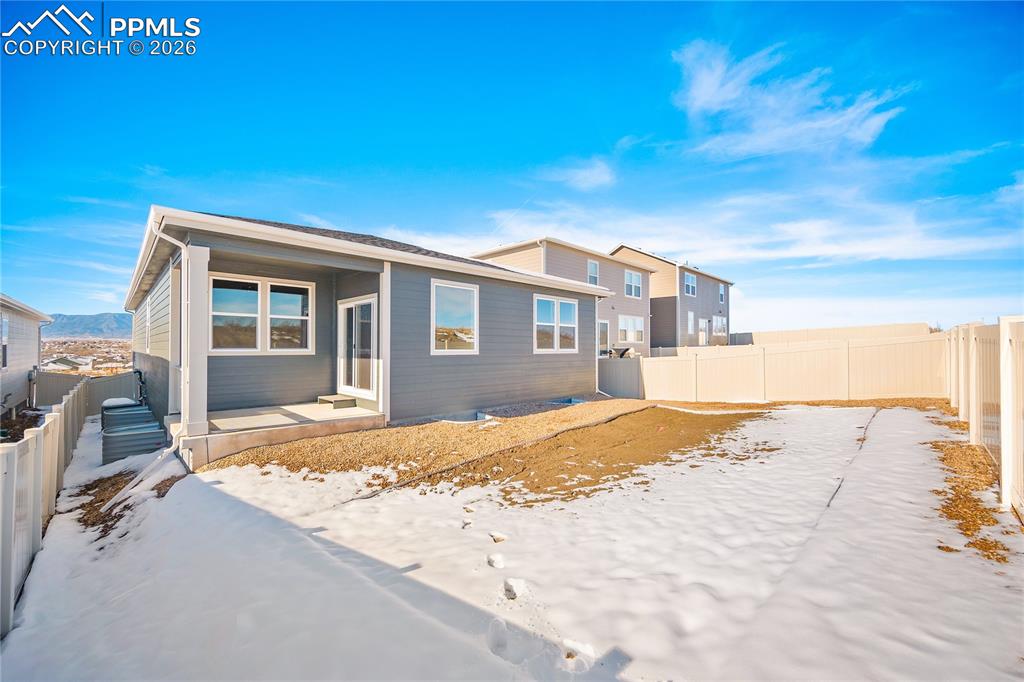 9653 Pinpoint Drive Fountain, CO 80817 - Photo 33 of 34 a view of a house with a patio
