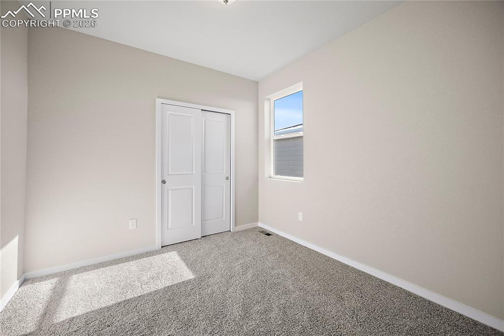 9653 Pinpoint Drive Fountain, CO 80817 - Photo 7 of 34 a view of an empty room with a window