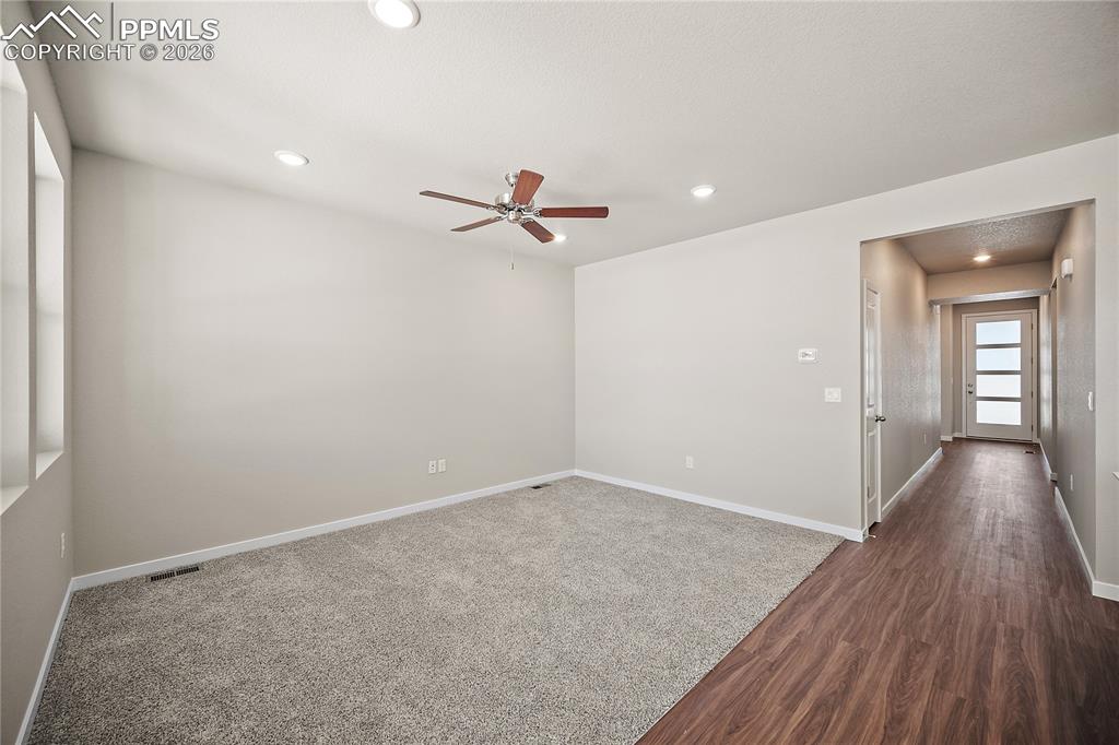 9653 Pinpoint Drive Fountain, CO 80817 - Photo 10 of 34 wooden floor in an empty room with a window