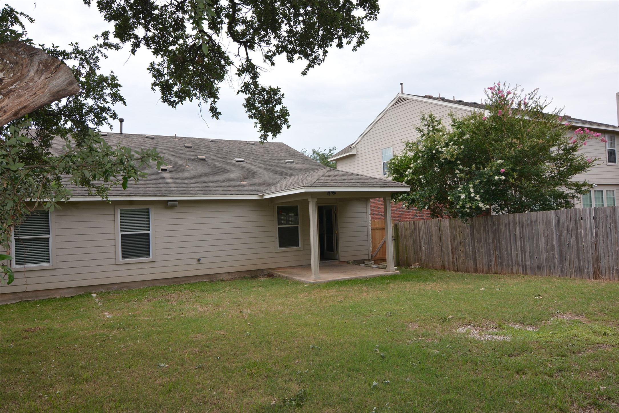 1303 Horseshoe Ranch Drive Leander, TX 78641 - Photo 25 of 26 An inviting covered patio extends from this comfortable house, offering peaceful outdoor living.