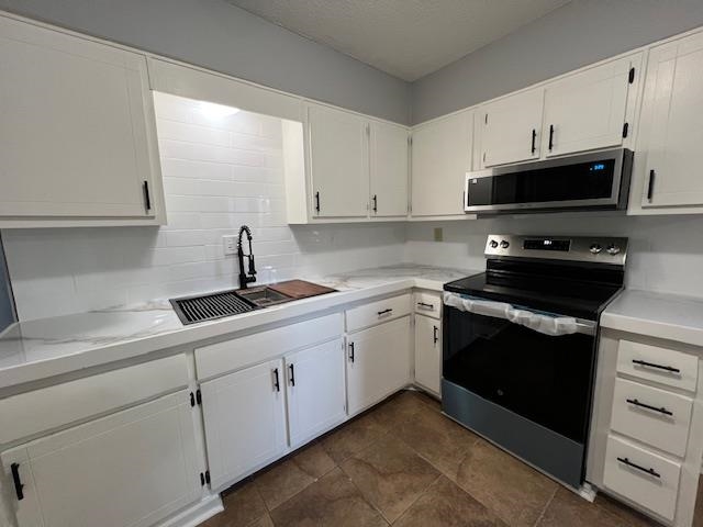 1012 Greencliff Road Collierville, TN 38017 - Photo 5 of 21 a kitchen with stainless steel appliances granite countertop a sink and a stove