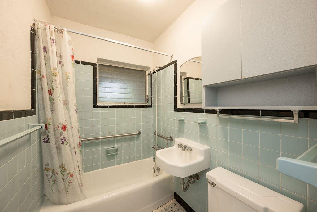 719 Washington Street Key West, FL 33040 - Photo 13 of 28 a bathroom with a sink toilet and shower