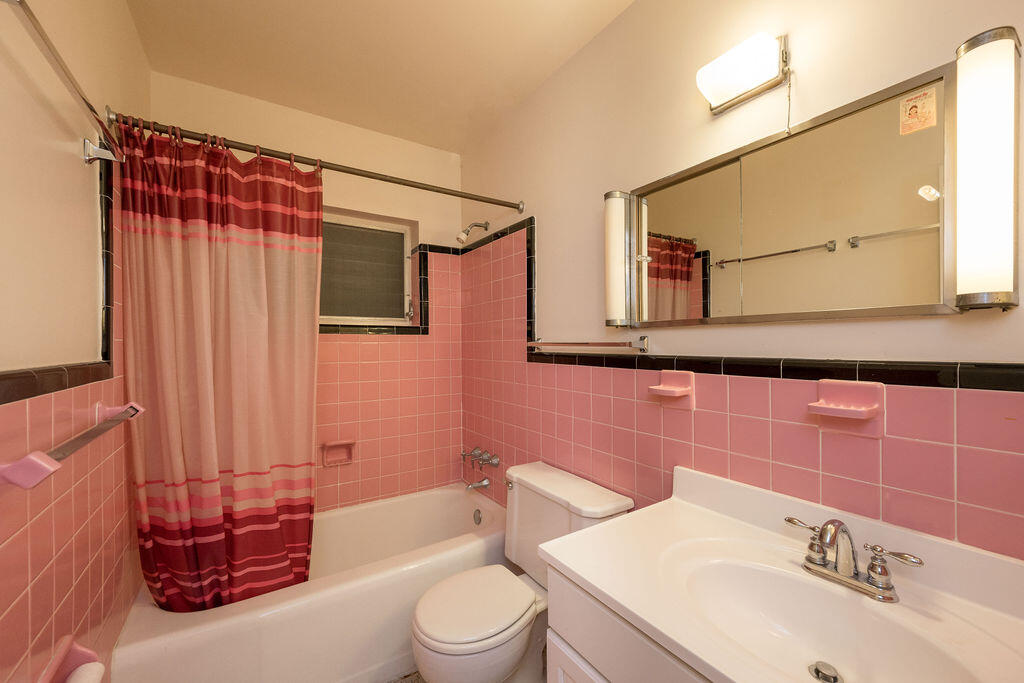 719 Washington Street Key West, FL 33040 - Photo 16 of 28 a bathroom with a sink toilet and shower