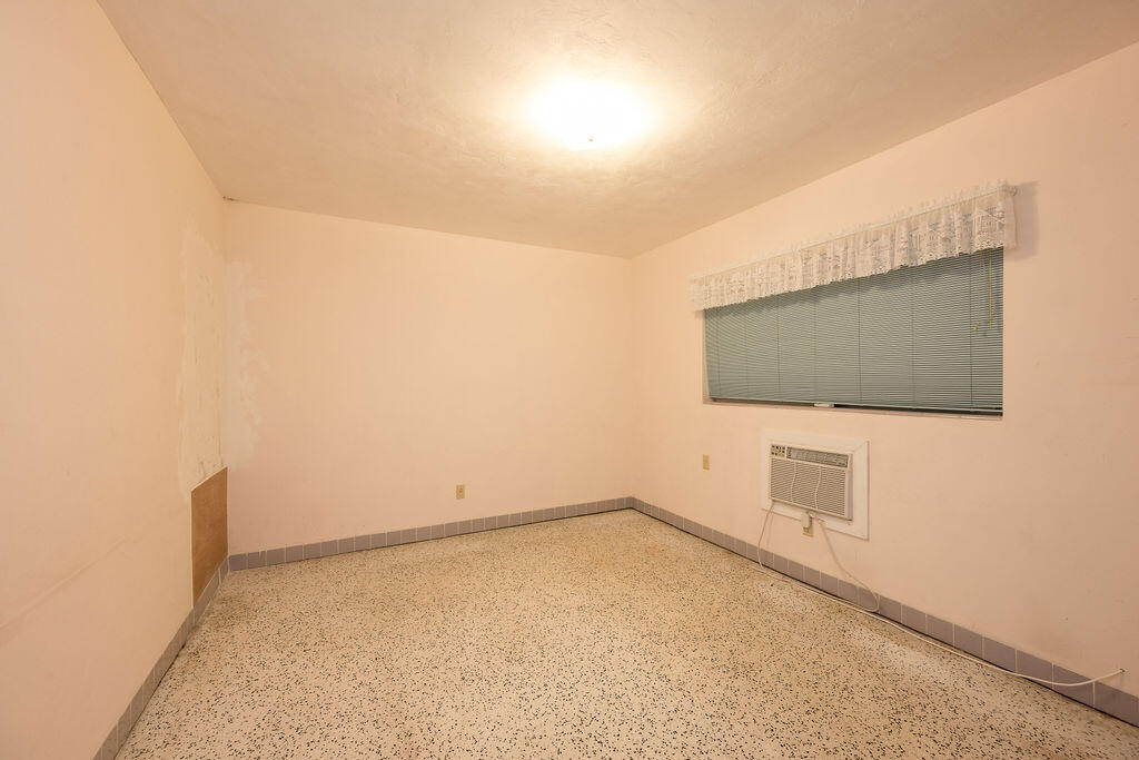 719 Washington Street Key West, FL 33040 - Photo 18 of 28 a view of a livingroom with an empty space and wooden floor