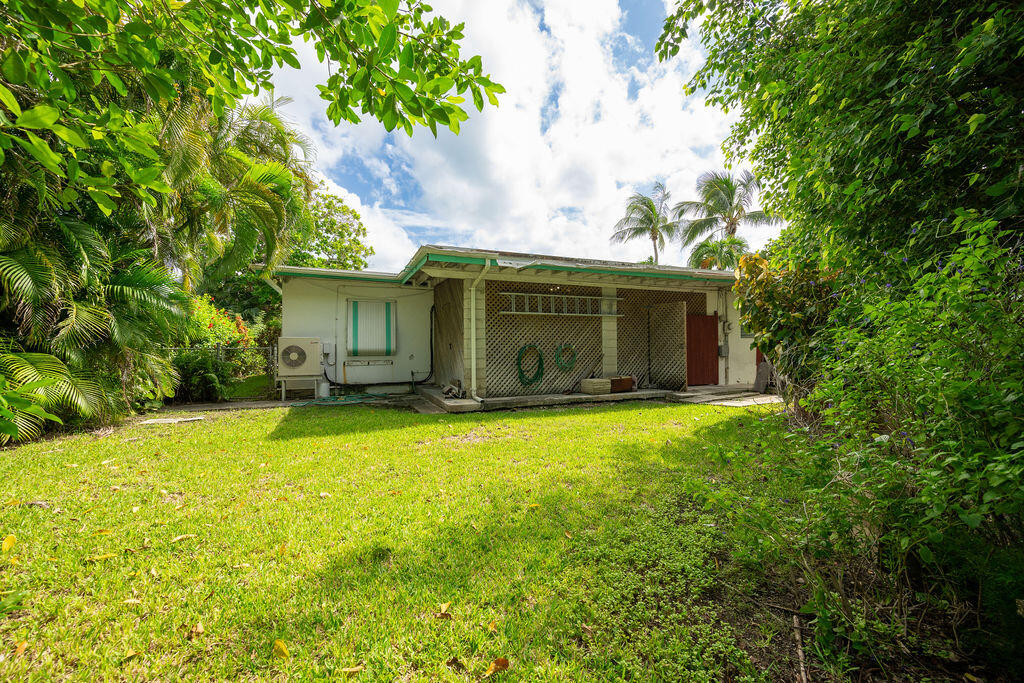 719 Washington Street Key West, FL 33040 - Photo 25 of 28 a front view of the house with a garden