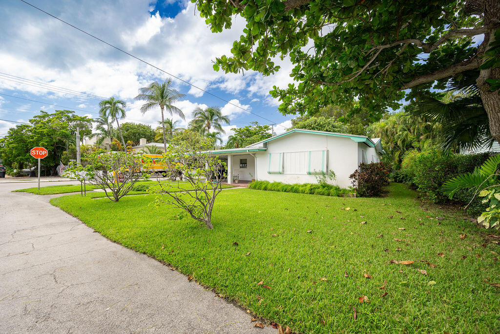 719 Washington Street Key West, FL 33040 - Photo 27 of 28 a view of an house with backyard space and porch