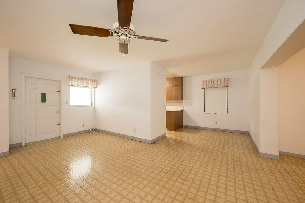 719 Washington Street Key West, FL 33040 - Photo 6 of 28 a view of an empty room with a window