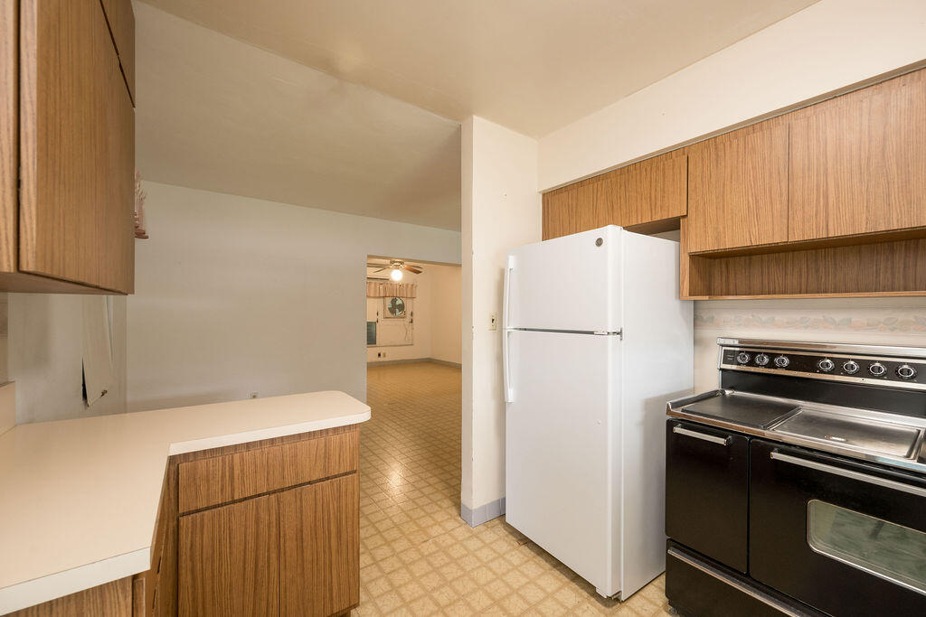 719 Washington Street Key West, FL 33040 - Photo 8 of 28 a kitchen with a refrigerator and a stove
