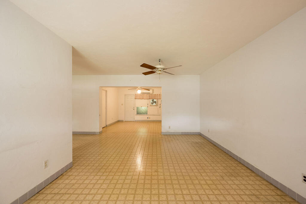 719 Washington Street Key West, FL 33040 - Photo 10 of 28 a view of a livingroom with a ceiling fan and window