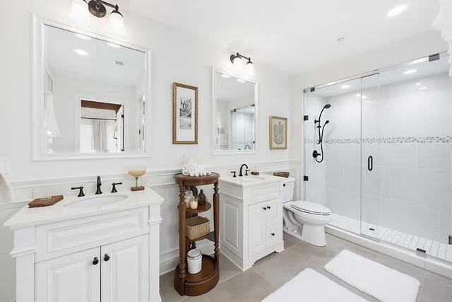 an aerial view of a house with garden space and street view