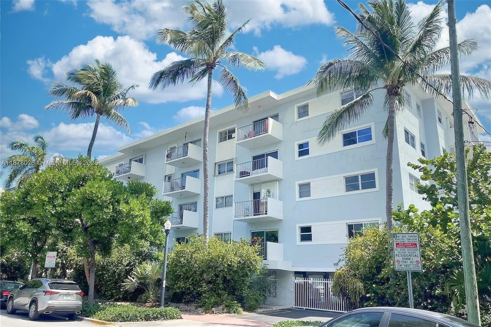 221 Meridian Avenue, Unit 211 Miami Beach, FL 33139 - Photo 12 of 20 a view of a tall building with a yard and potted plants