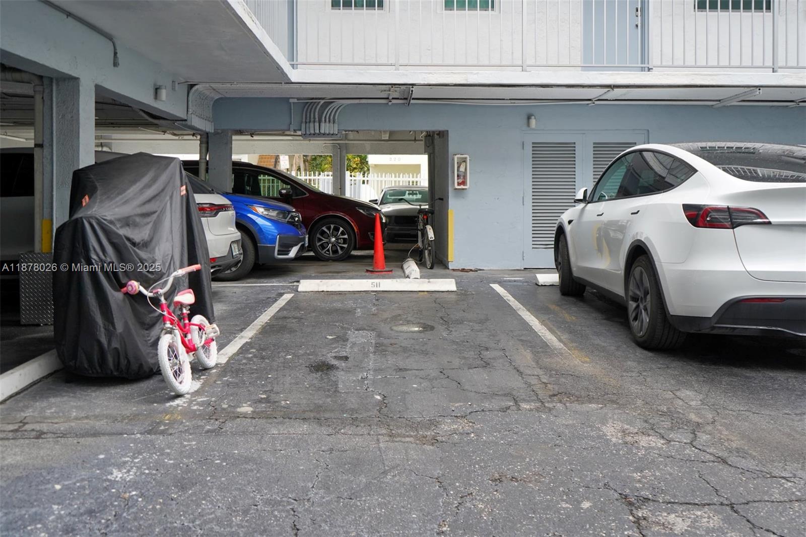 221 Meridian Avenue, Unit 211 Miami Beach, FL 33139 - Photo 17 of 20 a view of parking garage with cars