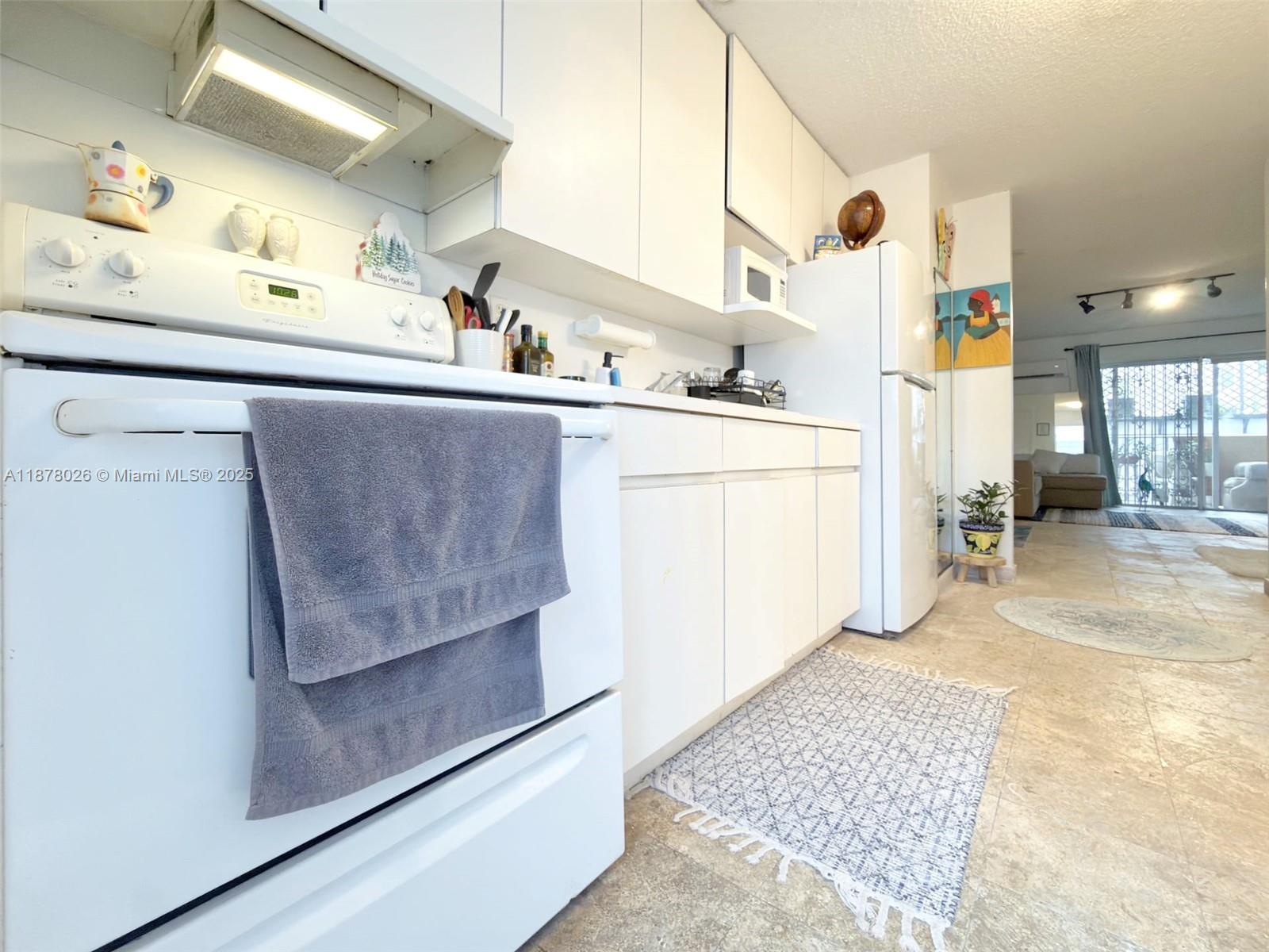 221 Meridian Avenue, Unit 211 Miami Beach, FL 33139 - Photo 5 of 20 a room with storage and utility