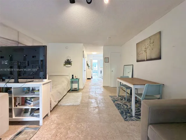 a view of a livingroom with furniture and window