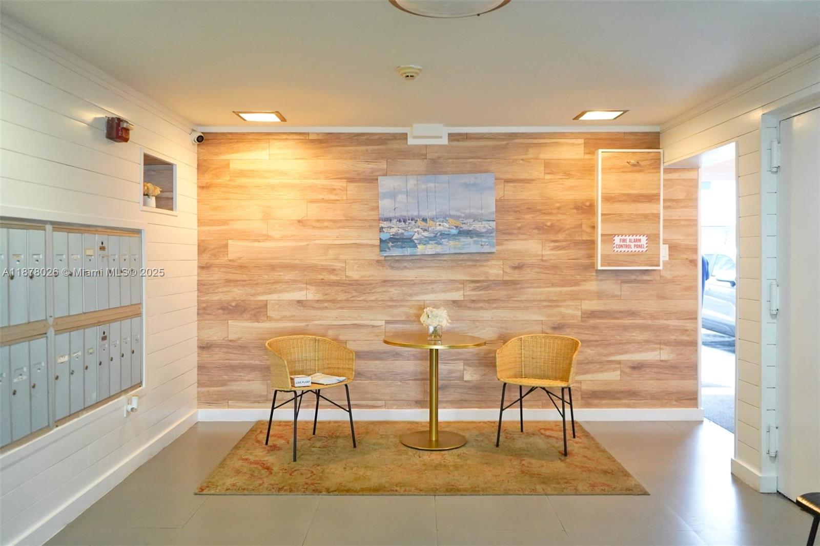 221 Meridian Avenue, Unit 211 Miami Beach, FL 33139 - Photo 9 of 20 a view of a hallway with wooden floor