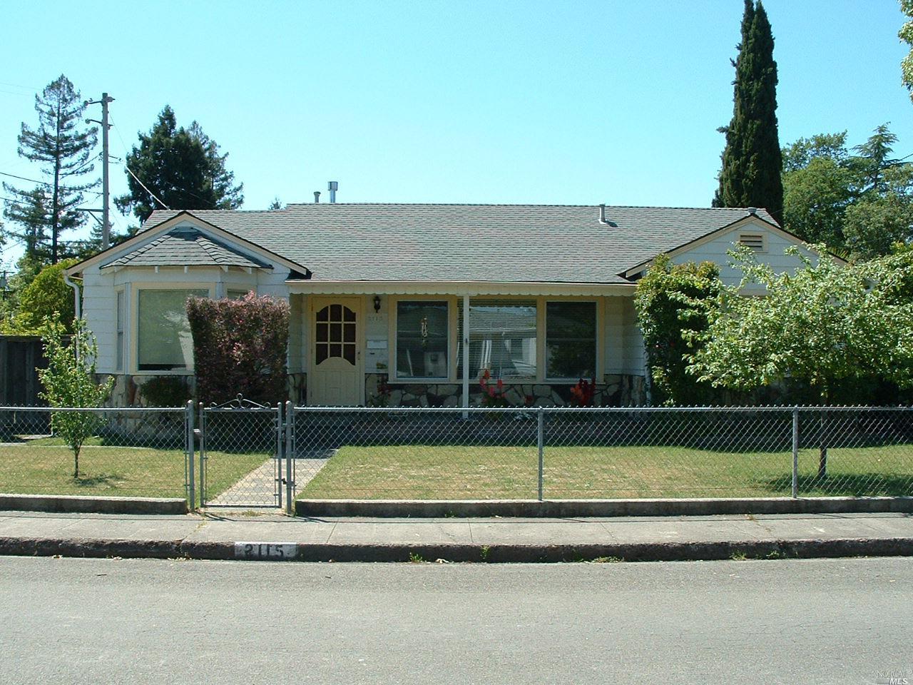 a view of a house with a backyard and a swimming pool