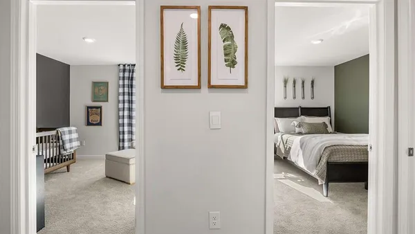a bedroom with a bed and a view of bathroom