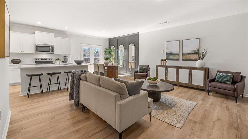 3566 Matthew Court Decatur, GA 30030 - Photo 3 of 18 a living room with furniture and a dining table with kitchen view