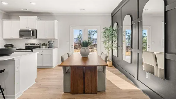 a kitchen with stainless steel appliances a sink stove and refrigerator