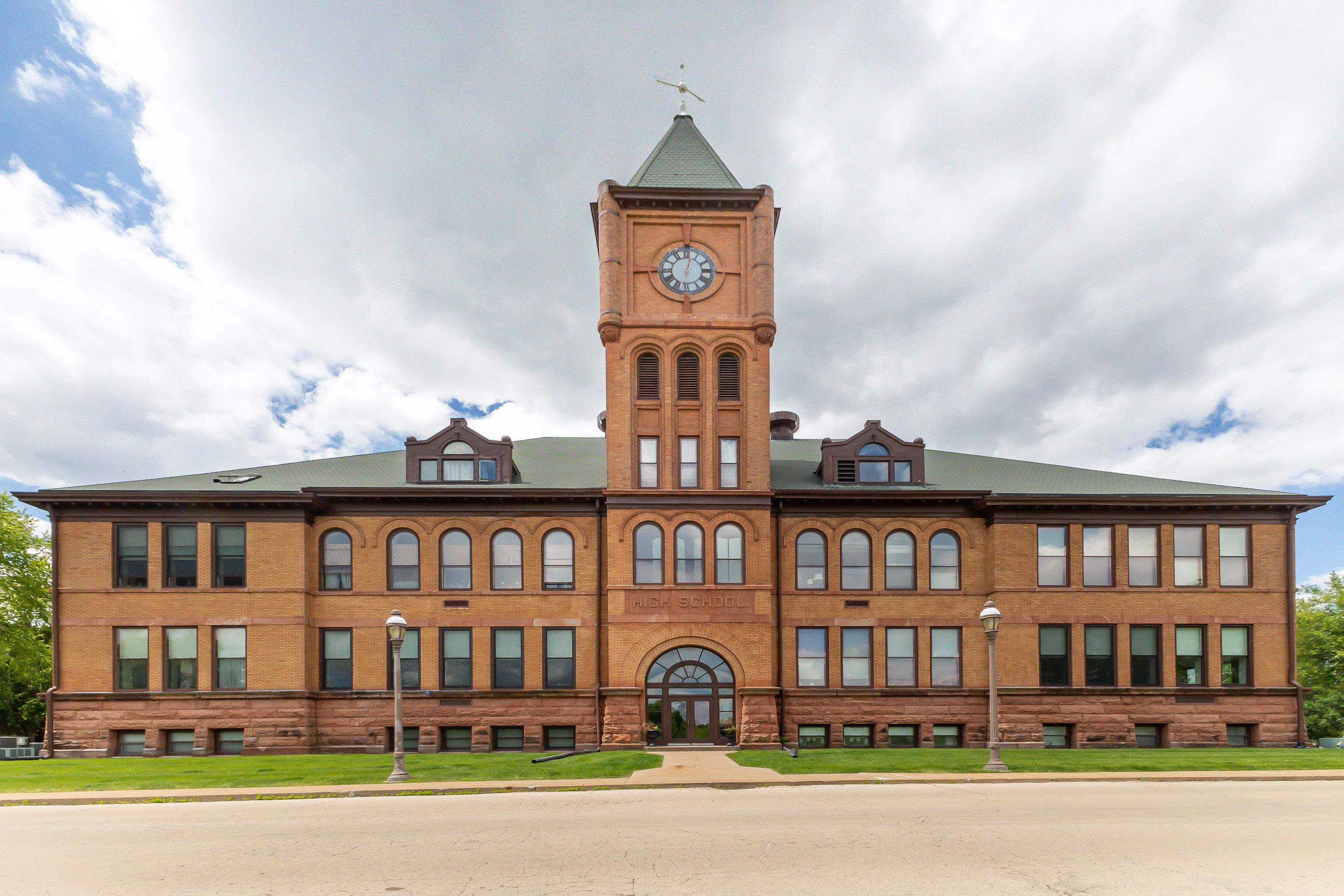 411 South Prospect Street, Unit 204 Galena, IL 61036 - Photo 1 of 18 a front view of a residential apartment building with a yard