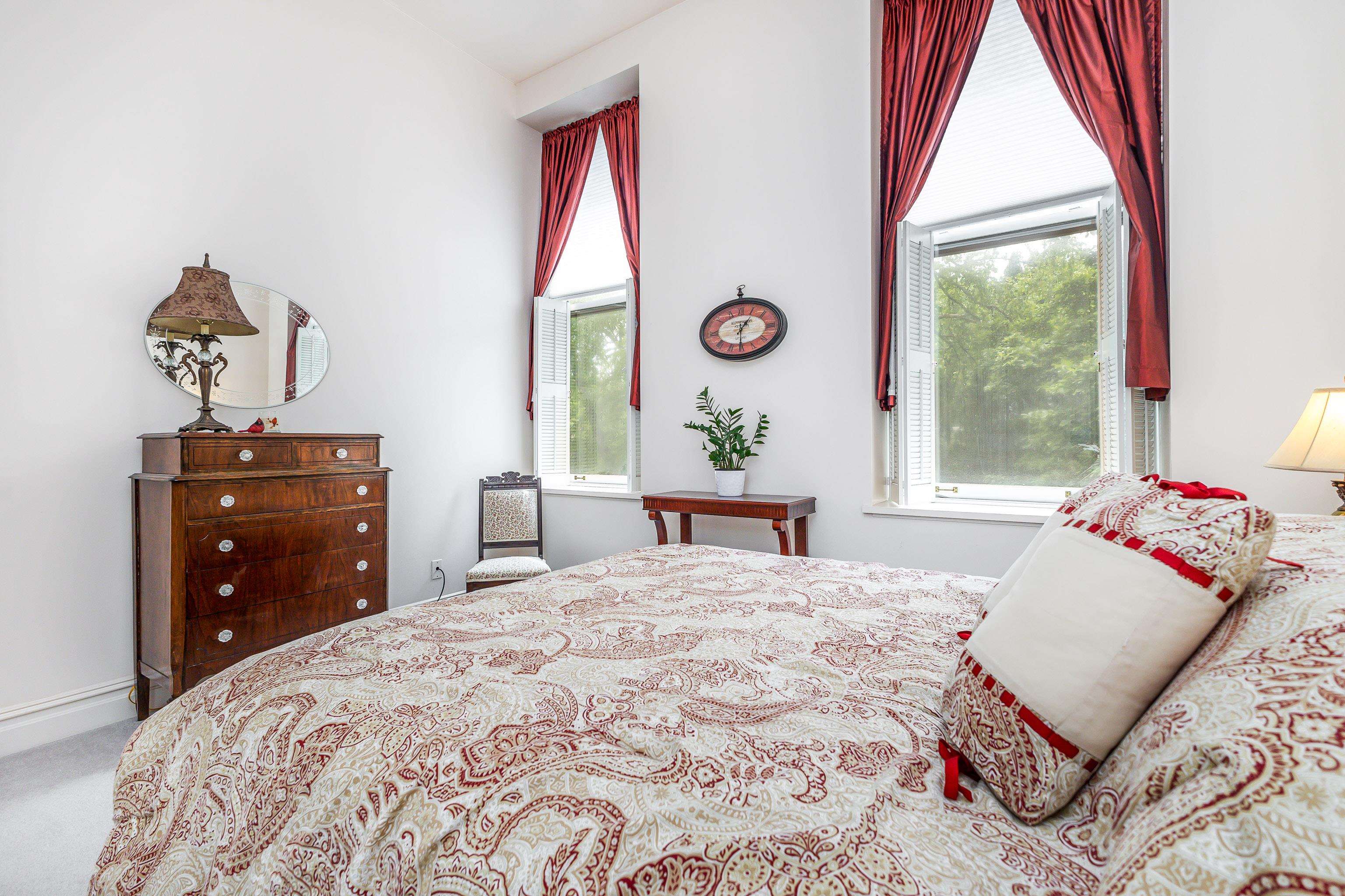 411 South Prospect Street, Unit 204 Galena, IL 61036 - Photo 14 of 18 a bedroom with a bed and a window