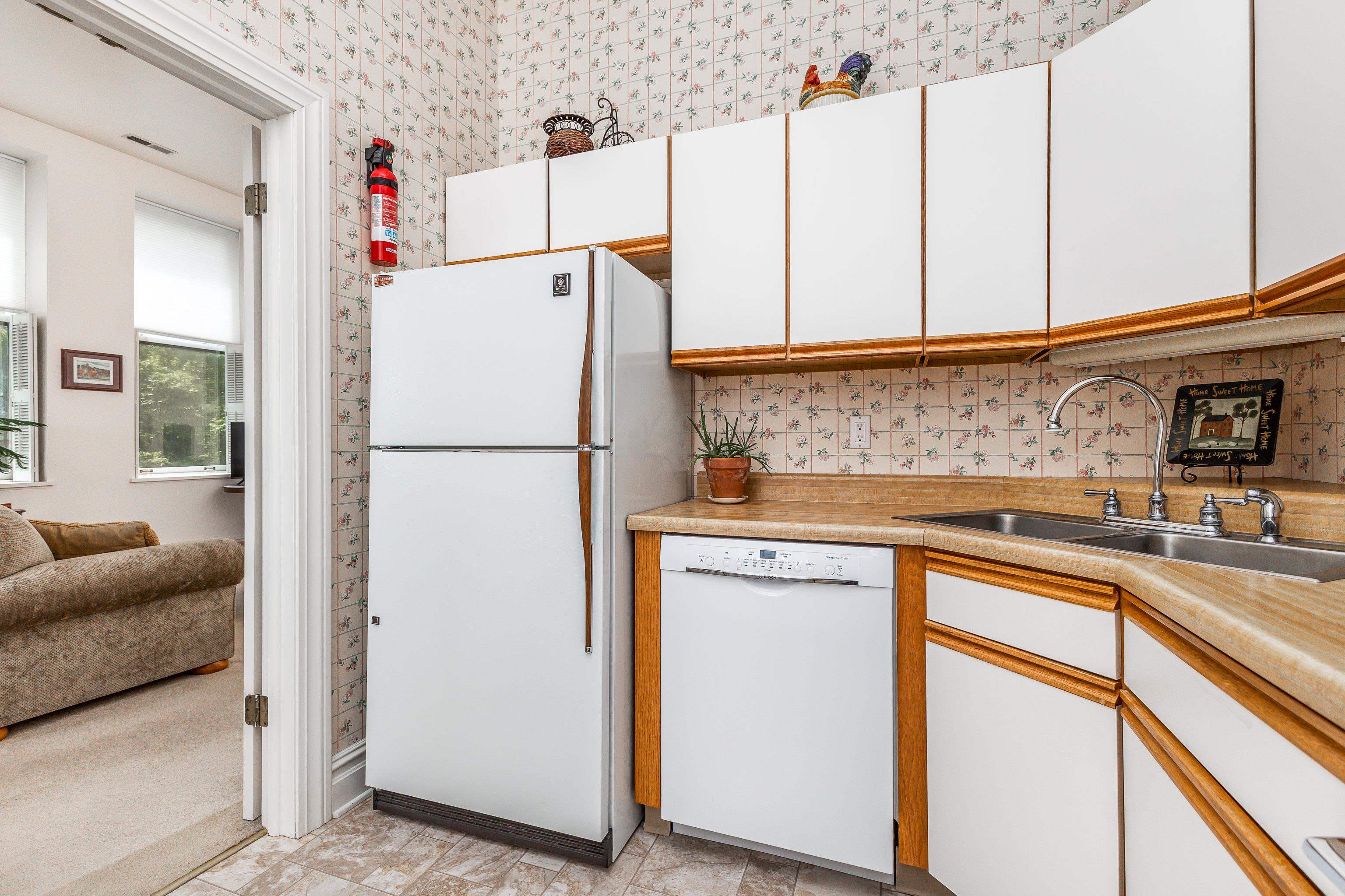 411 South Prospect Street, Unit 204 Galena, IL 61036 - Photo 8 of 18 a white refrigerator freezer sitting inside of a kitchen