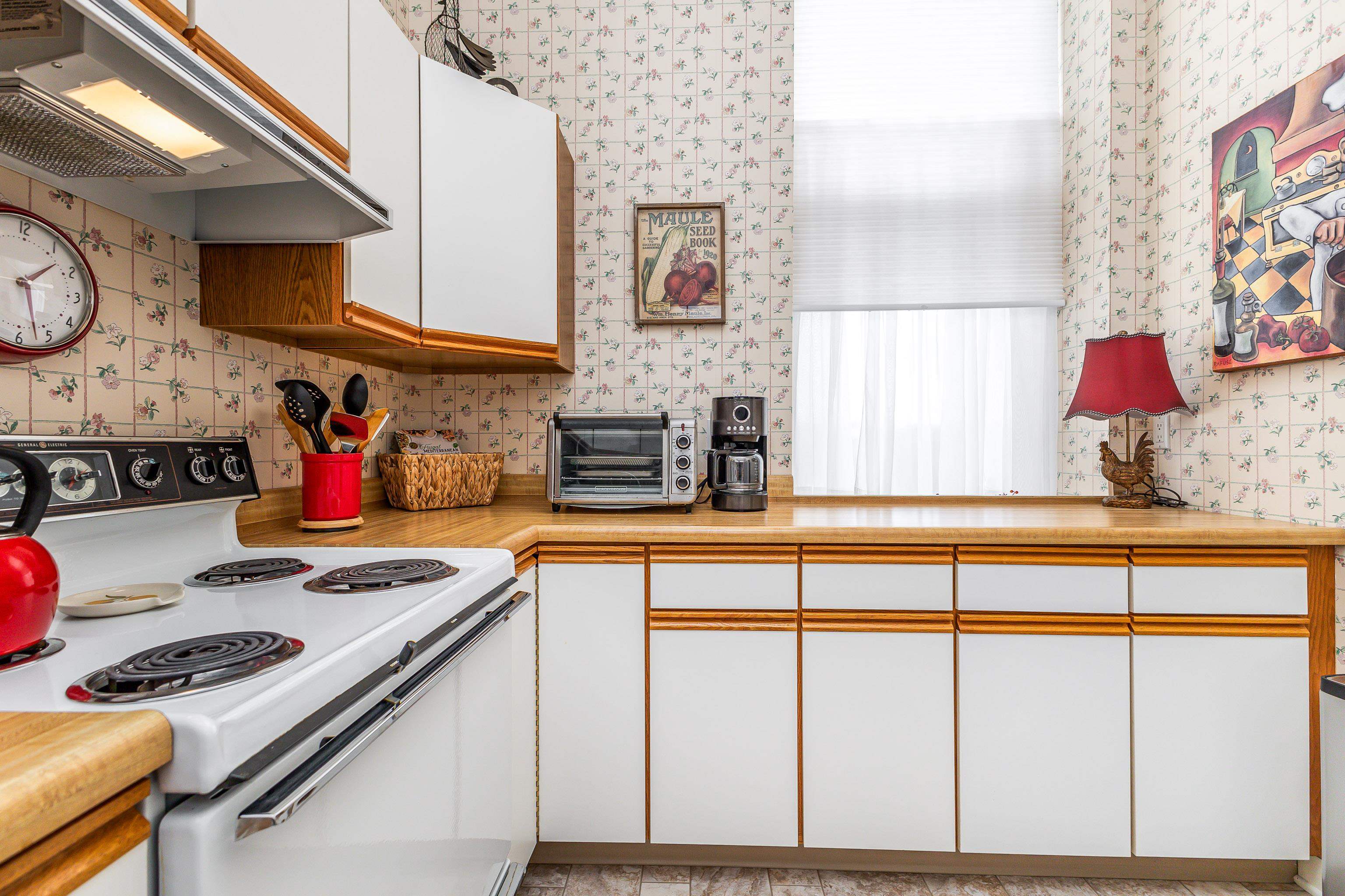411 South Prospect Street, Unit 204 Galena, IL 61036 - Photo 9 of 18 a kitchen with stainless steel appliances granite countertop a stove and cabinets